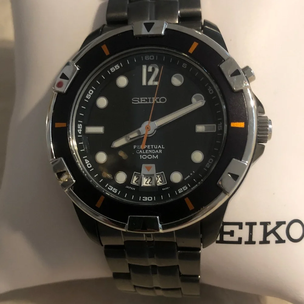 Seiko Black Dial Stainless Steel Watch with Orange Accents